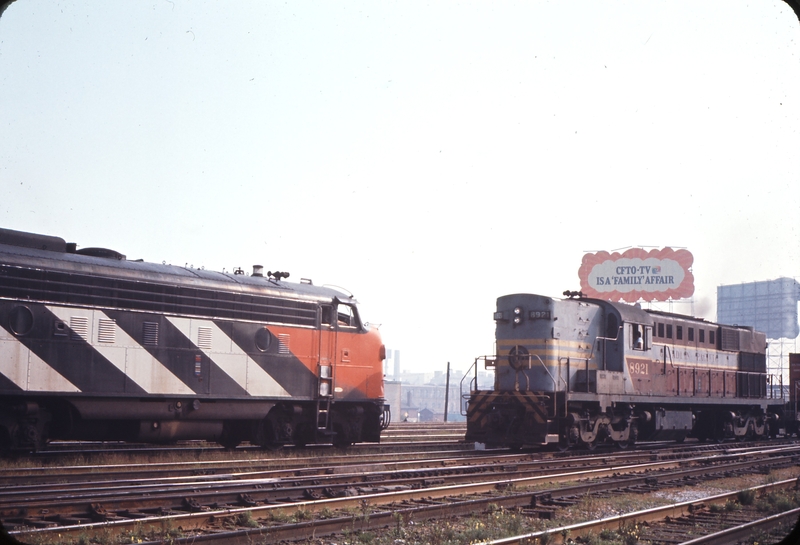 110564: Toronto Union Station No 60 Rapido 6534 leading and CP Westbound Freight 8921