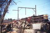 114127: MURLA Worksite C Codelfa Holland 3 6 gauge train discharging Muck In Background Up Goods from APM Fairfield T 391
