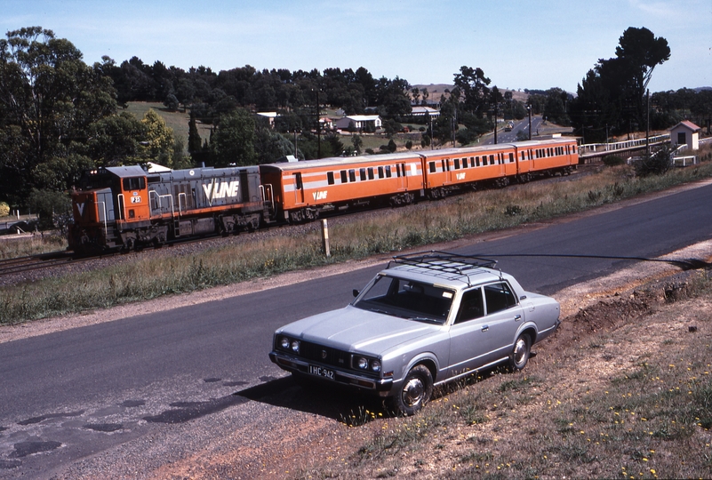 116354: Wandong 8314 Up Passenger from Seymour P 23 Langfords 1975 Model Toyota Crown in foreground