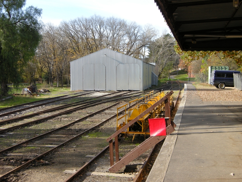 135354: Healesville looking towards end of track Stabled trolleys and staircase